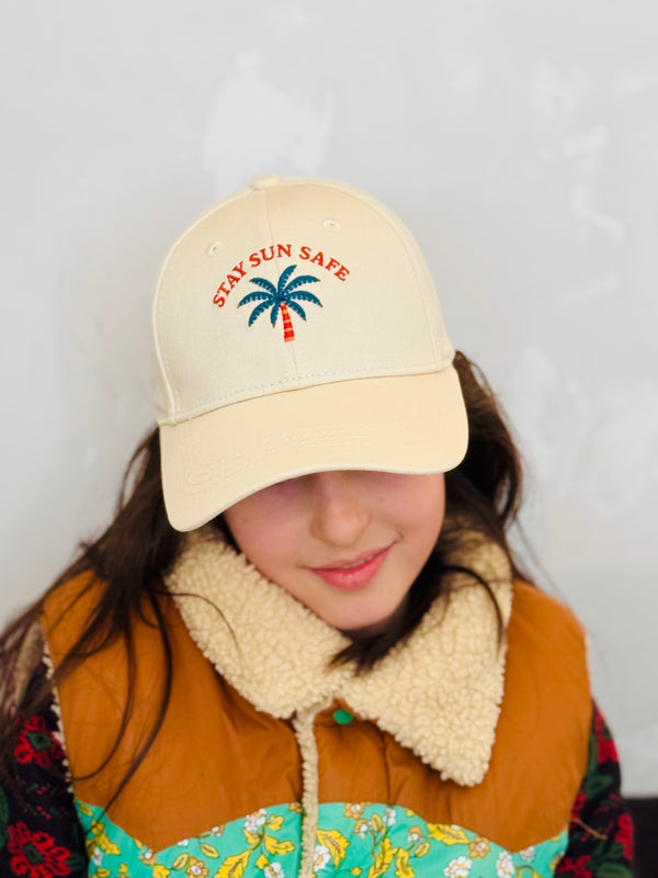 Kids wearing beige cotton baseball cap with Stay Sun Safe embroidery