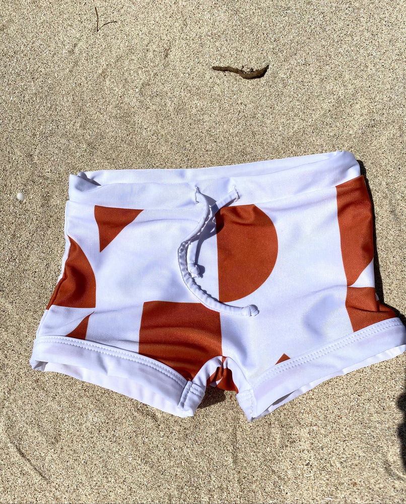 
            
                Load image into Gallery viewer, boxer rusty and white geometric print upf50+ anti uv sun safe swimwear 
            
        